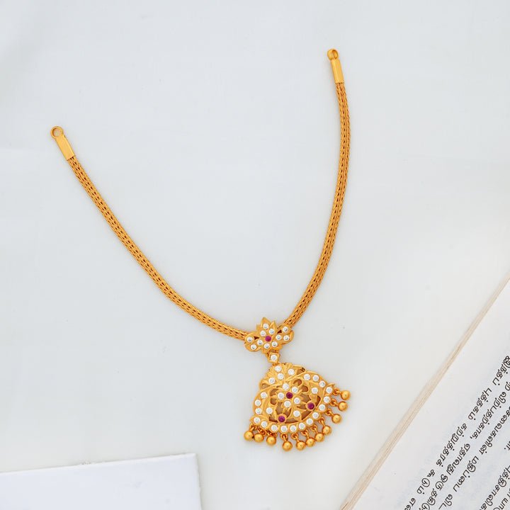 Traditional gold Attigai necklace with stone-studded pendant