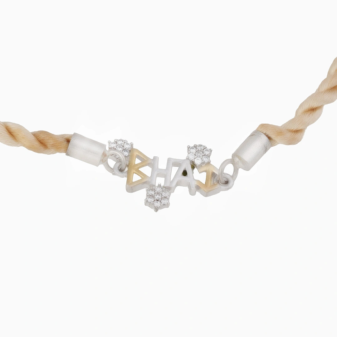925 Sterling silver rakhi in golden thread Ishna
