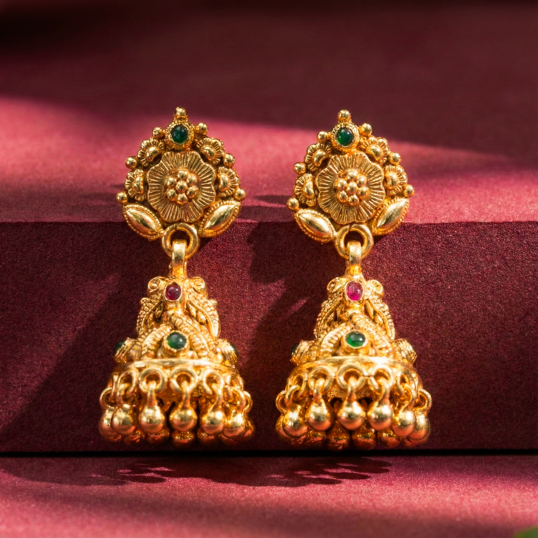 Antique gold jhumka earrings with stones