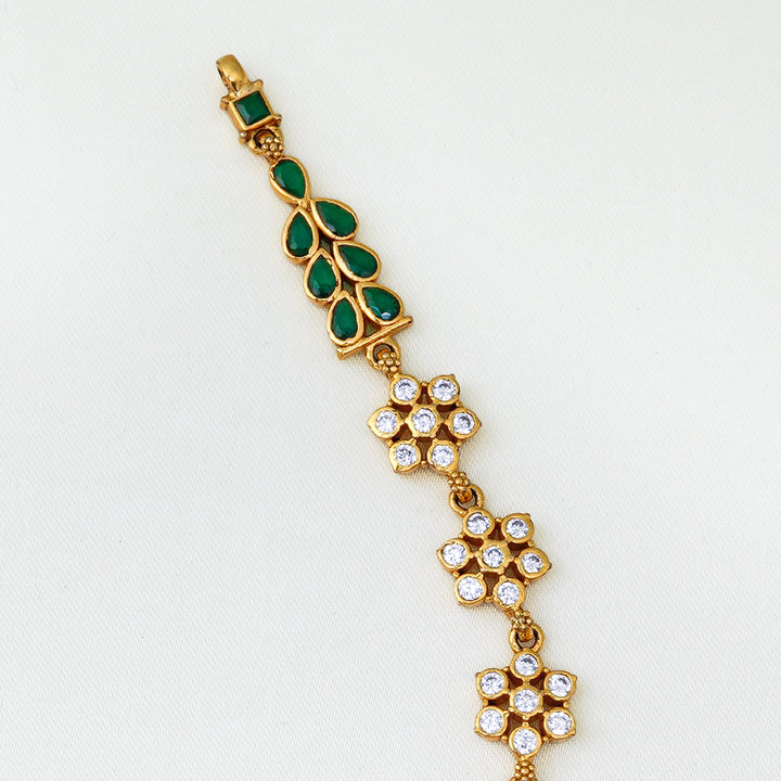 Antique gold necklace with green stone leaf design and Nakshi pendant