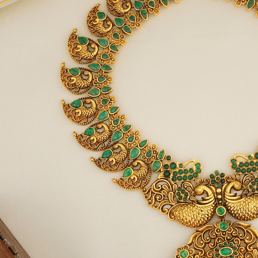 Antique gold peacock haram with green stones for brides