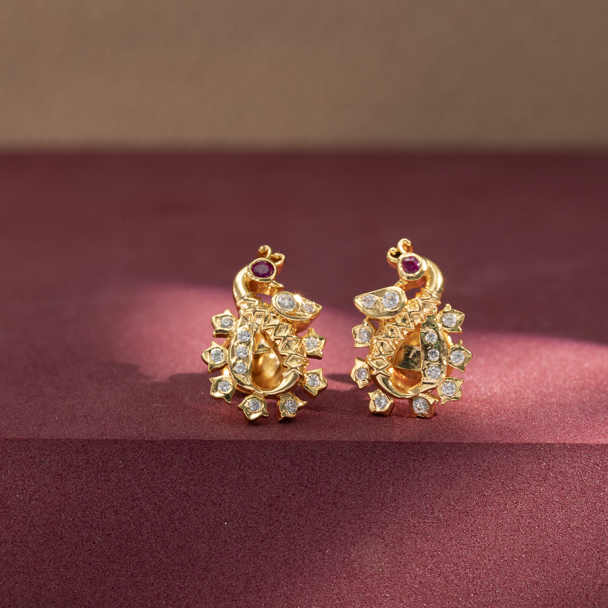 Antique gold plated peacock stud earrings