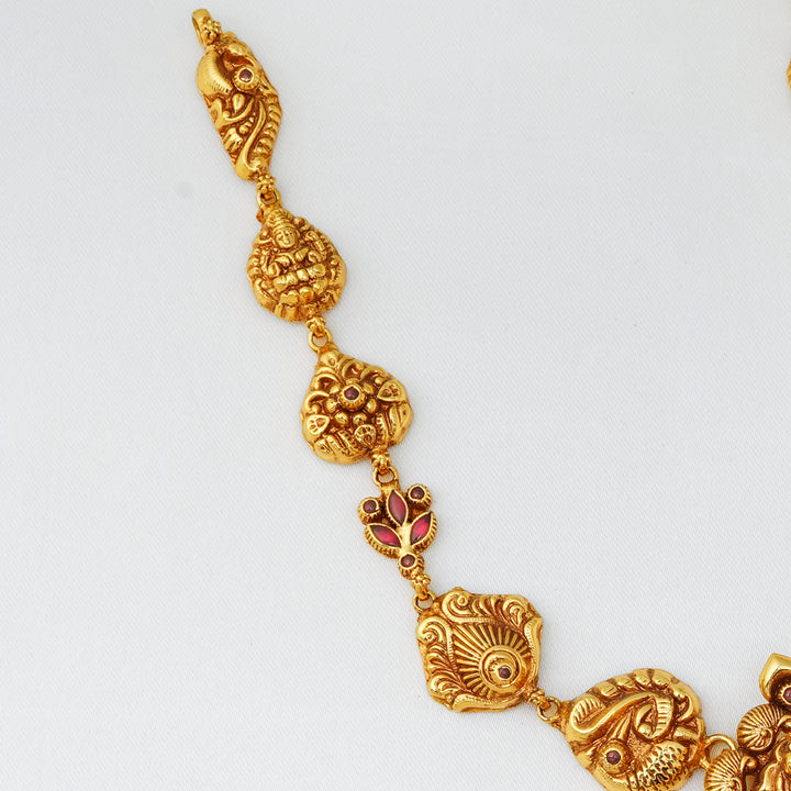 Antique gold plated short chain with Lakshmi and peacock pendant