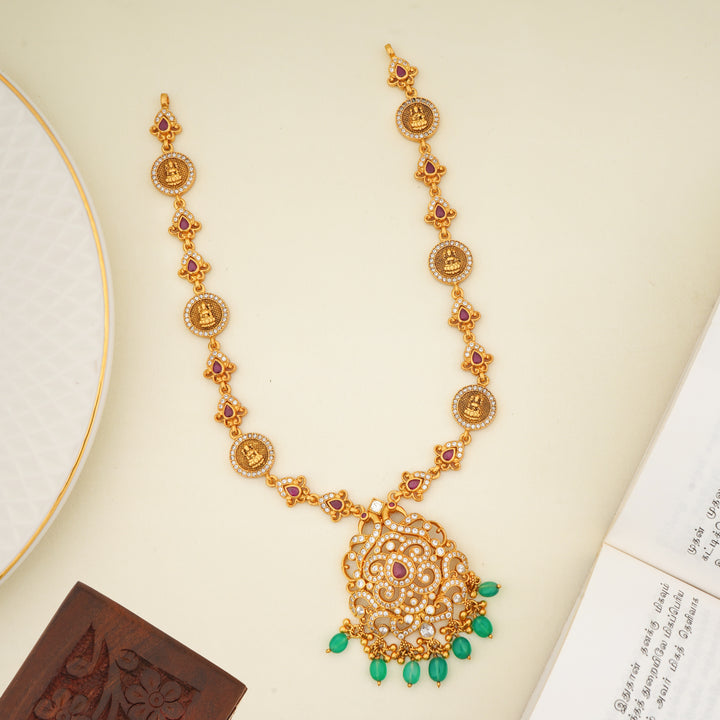 Antique gold plated temple haram with ruby stones and emerald bead drops