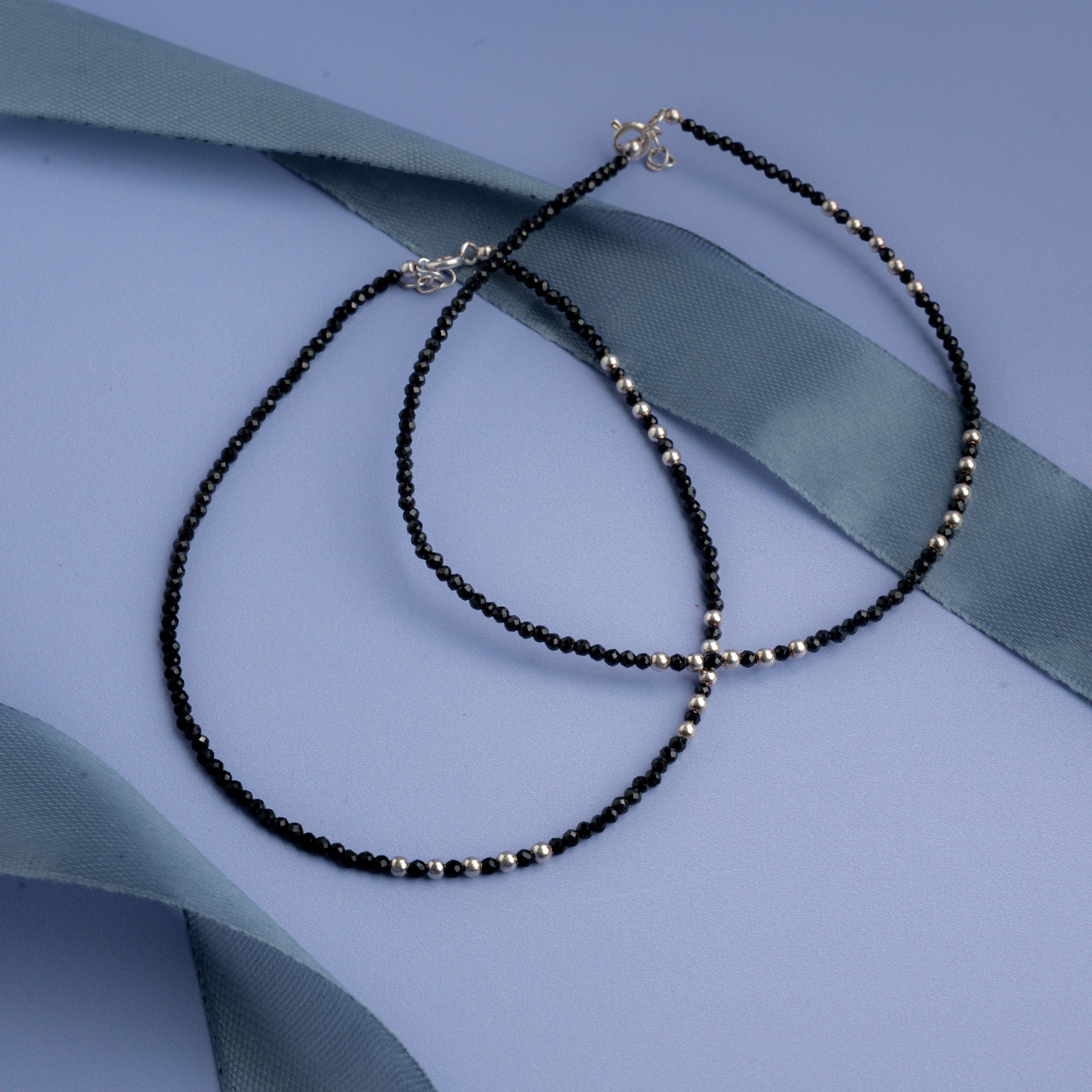 Black beaded anklet with silver bead