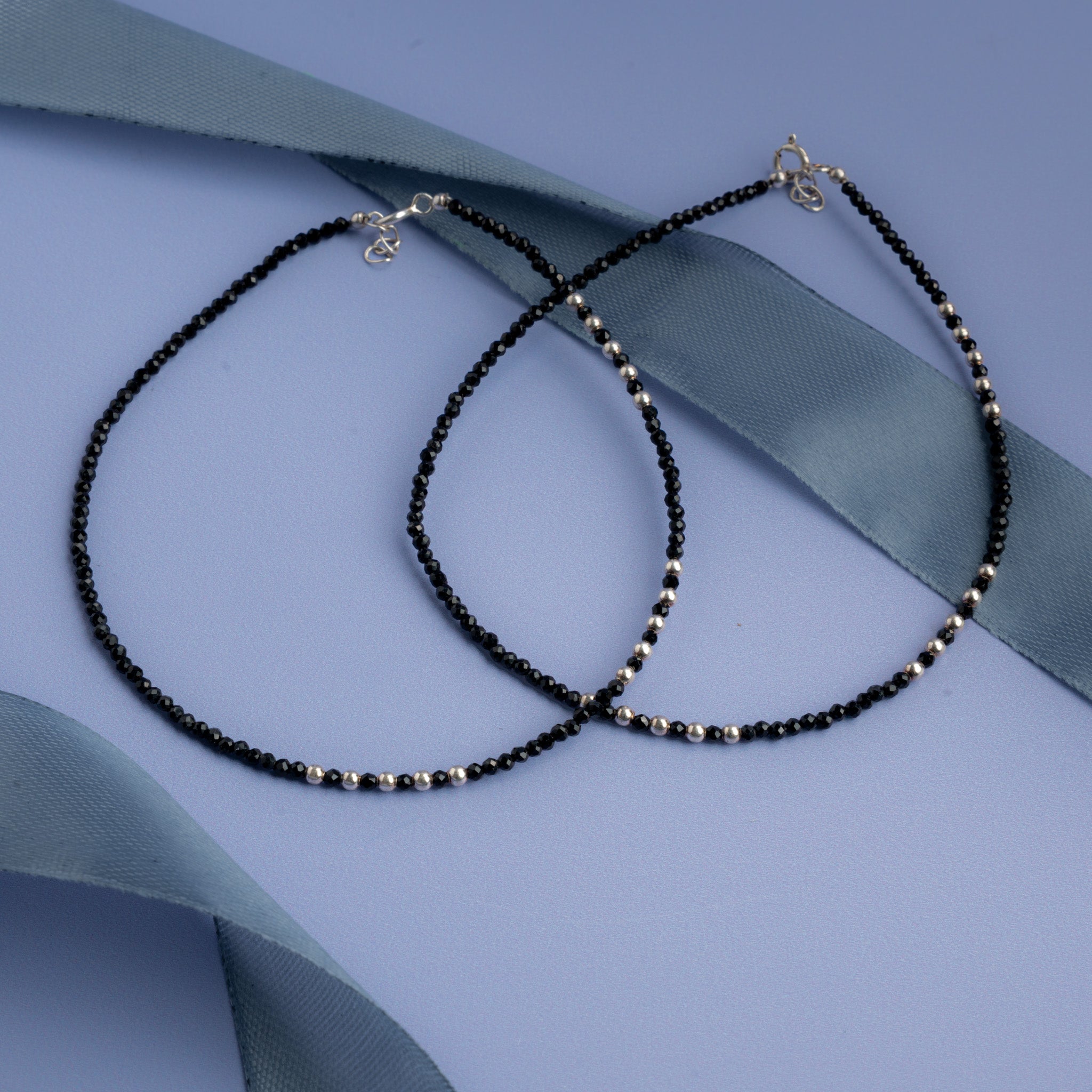 Black beaded anklet with small silver bead