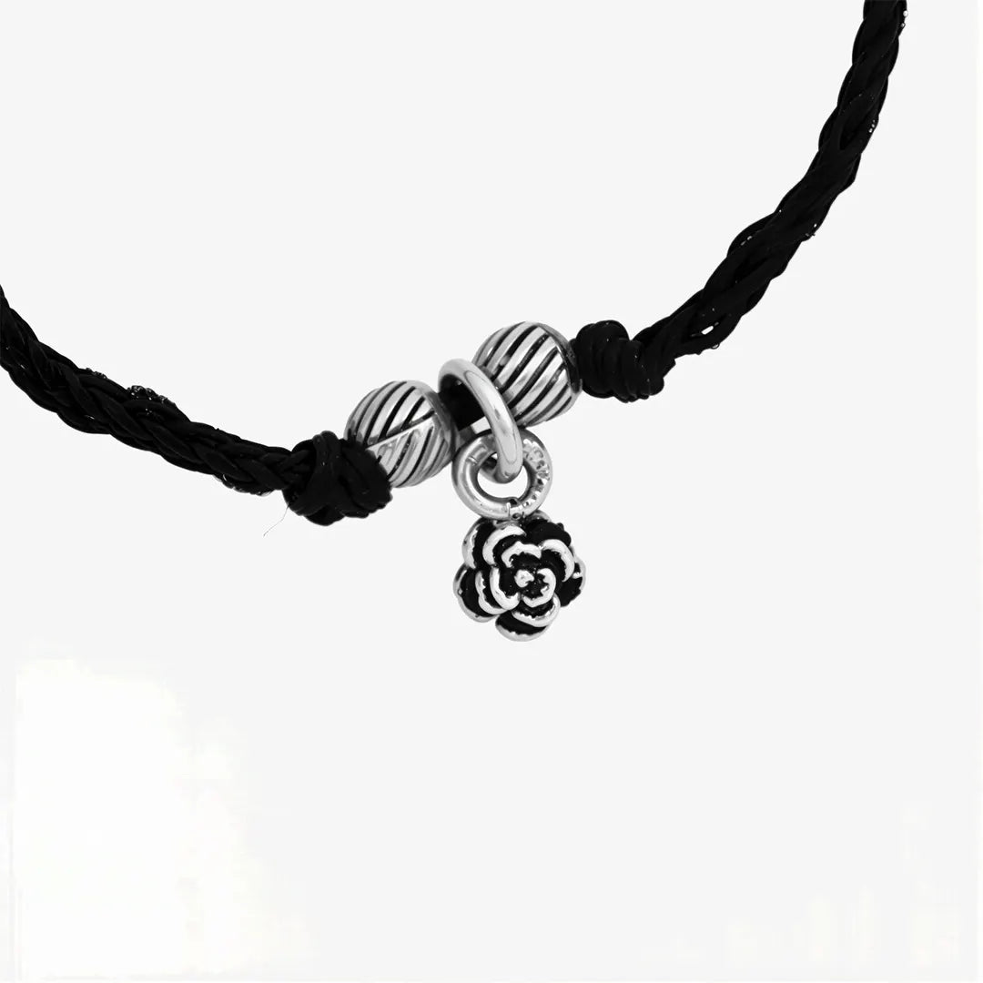 Black thread bracelet with silver beads