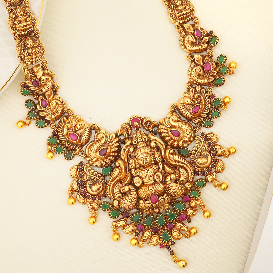 Bridal temple jewellery with red and green stone work