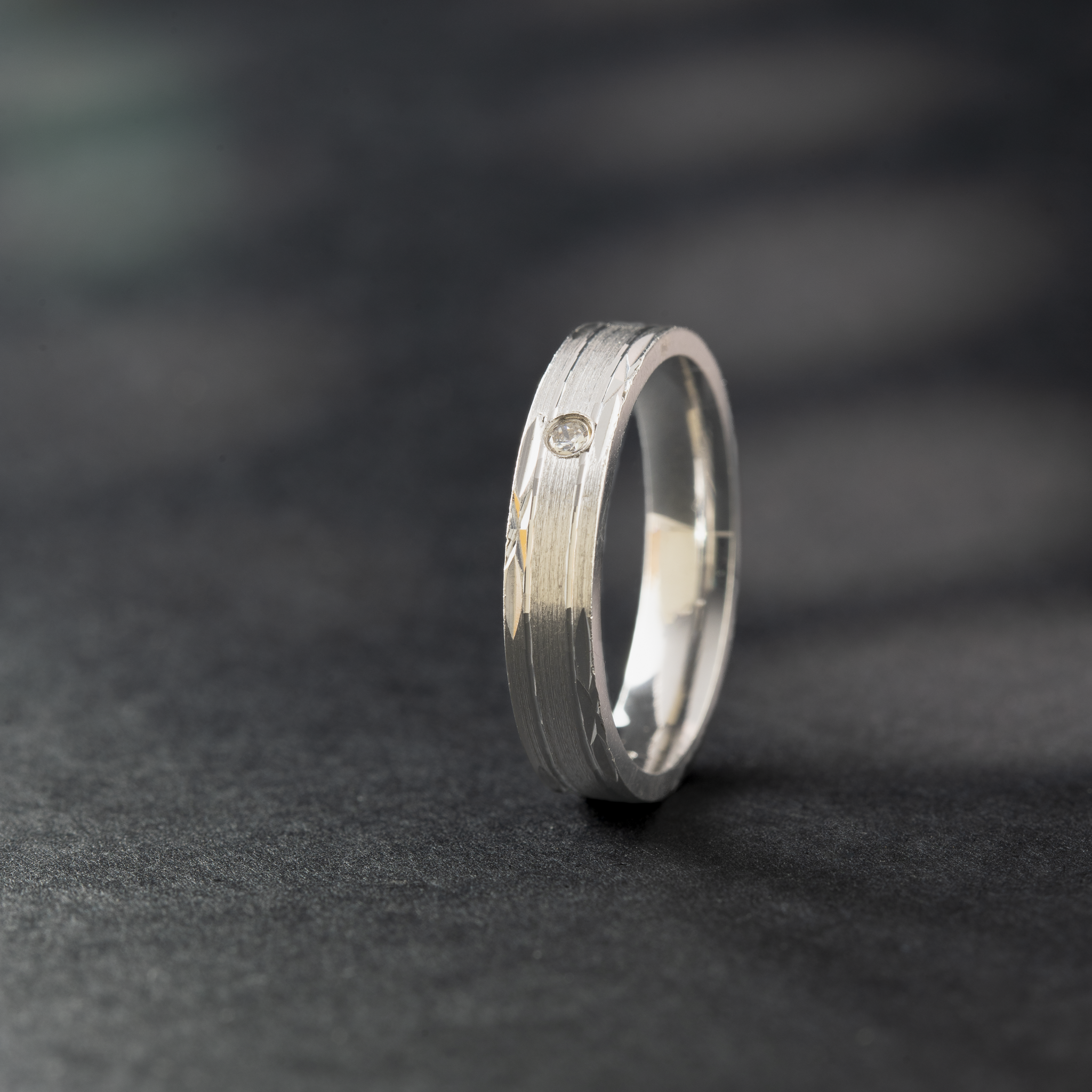Brushed finish silver ring with stone