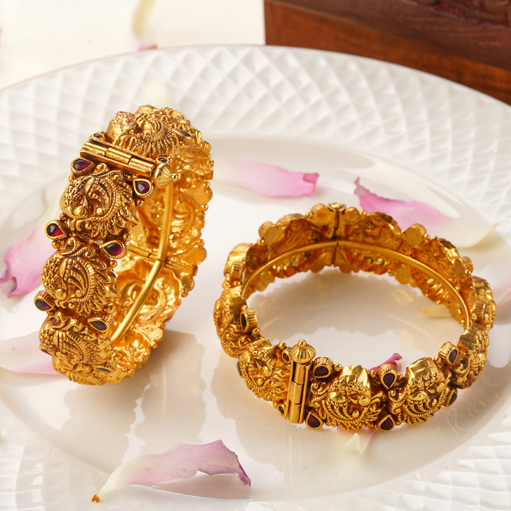 Buy screw type gold bangles online with peacock motif design