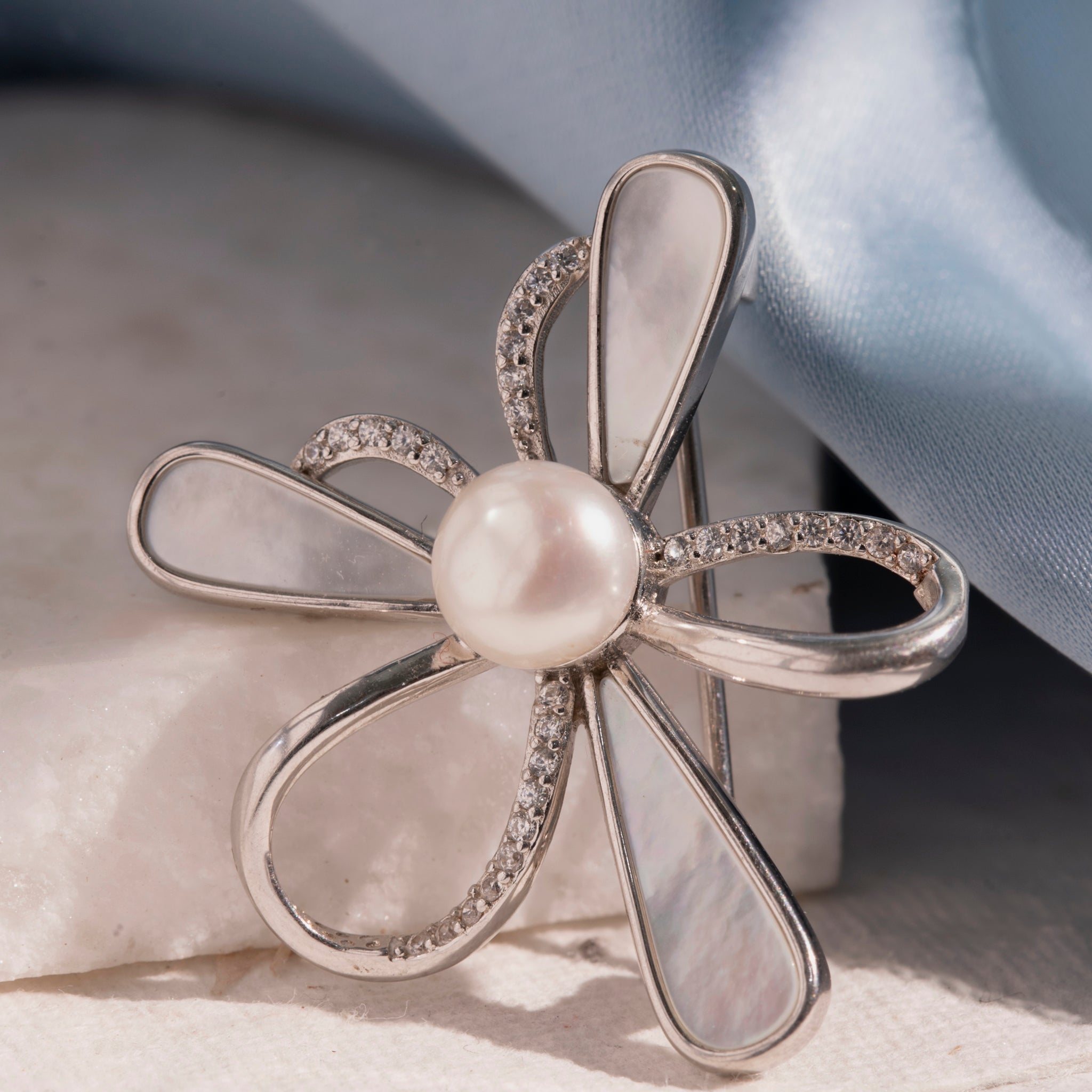 Designer floral brooch with stone accents