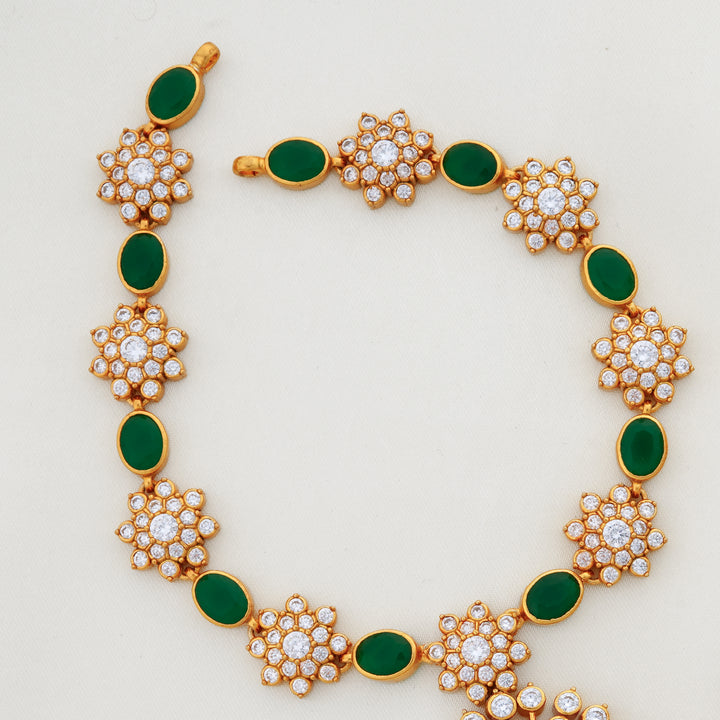 Designer short chain with emerald and crystal flower pendant
