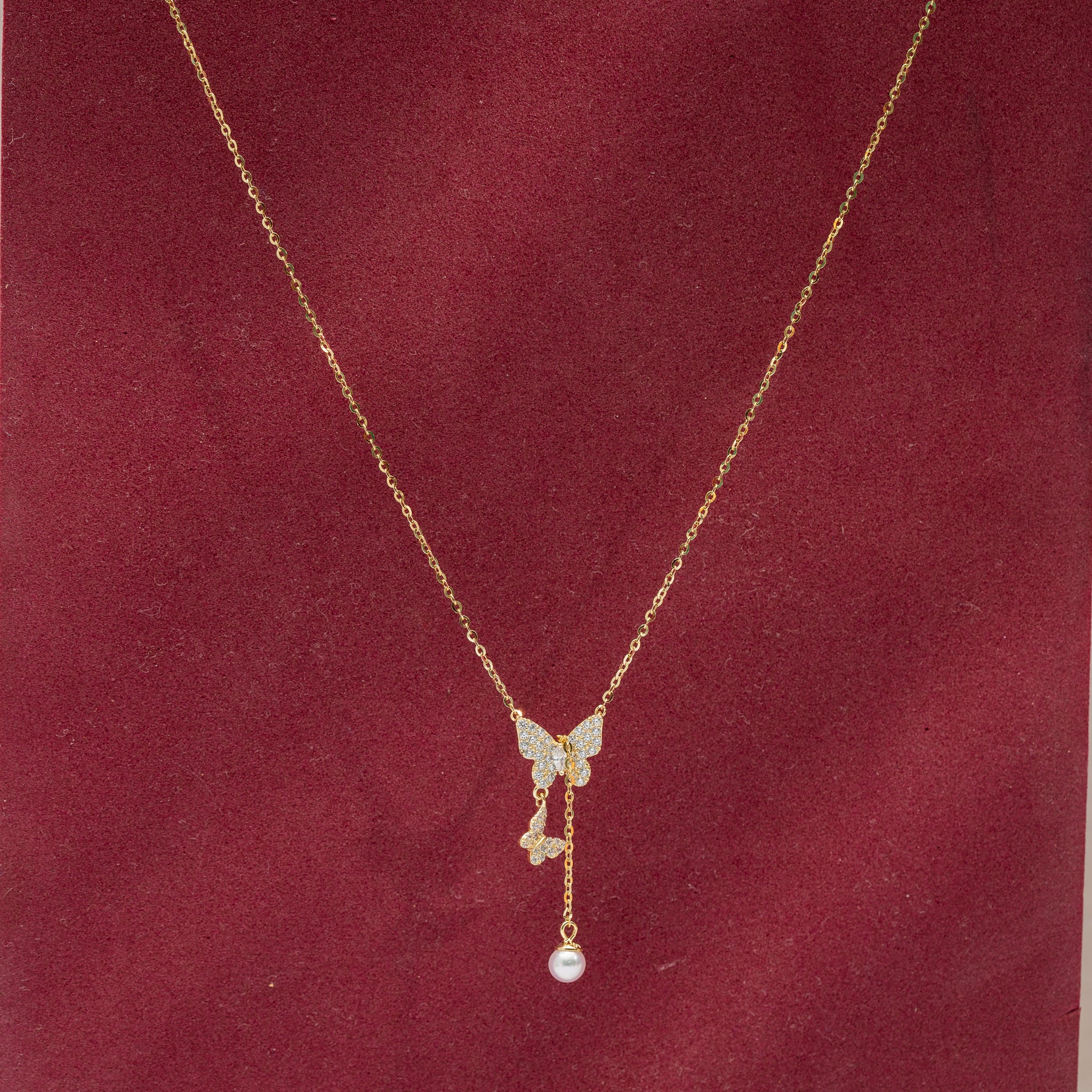Elegant butterfly pearl drop necklace