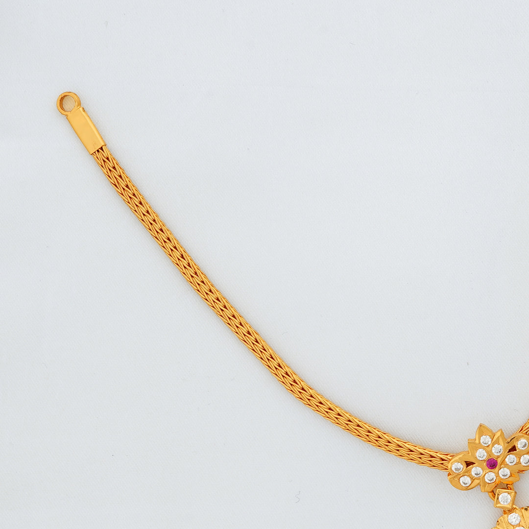 Elegant short gold Attigai necklace with temple-style pendant