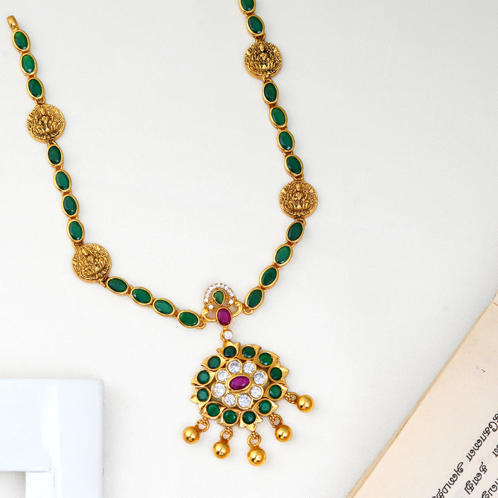 Emerald Lakshmi necklace with traditional temple design and green stones