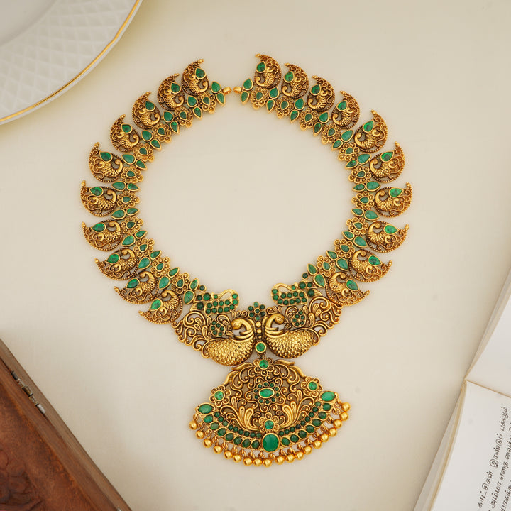 Emerald studded peacock design temple haram in antique gold
