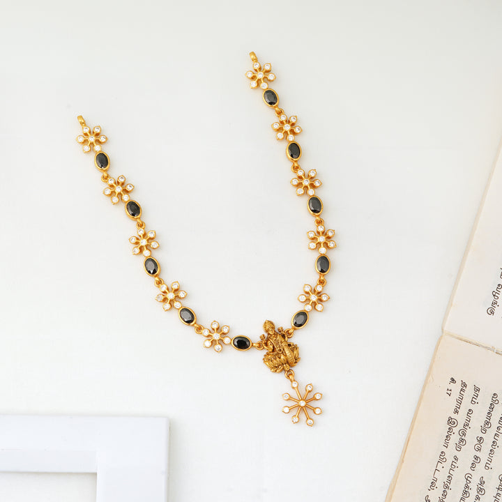 Floral Lakshmi necklace with black onyx and antique gold finish
