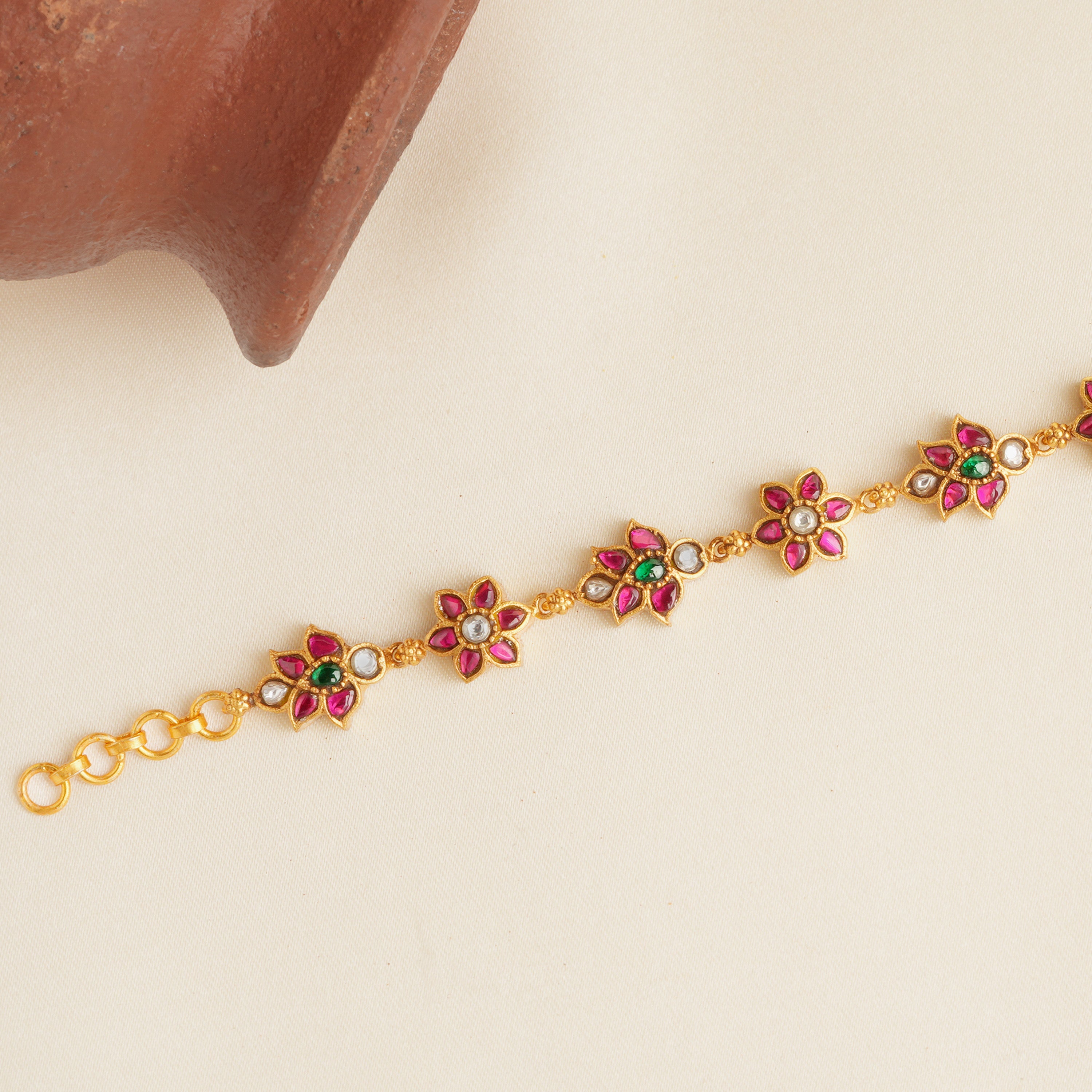 Floral kundan bracelet with ruby and emerald stones