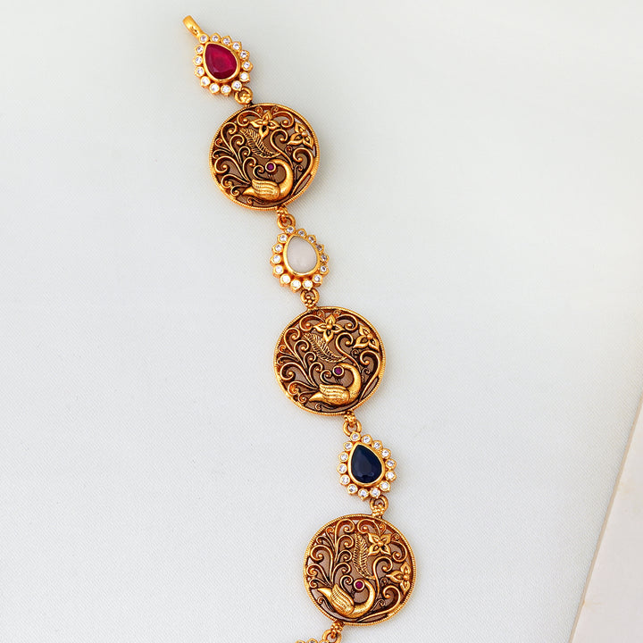 Gold-plated Annam design necklace with Navaratna stones for festive wear