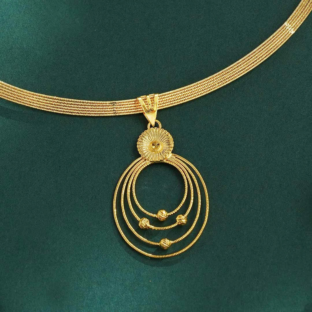 Gold circular pendant necklace with earrings