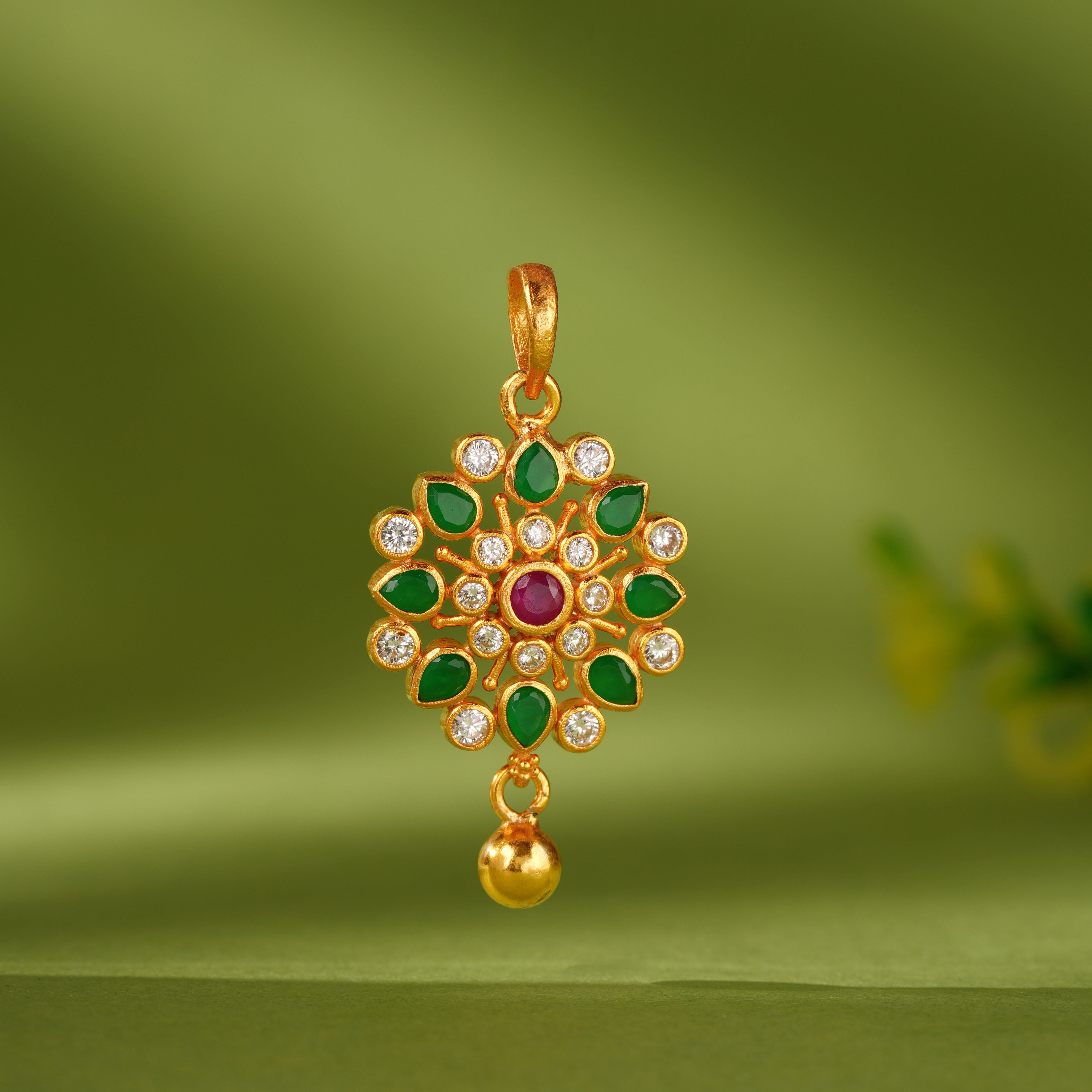 Gold plated floral emerald stone pendant