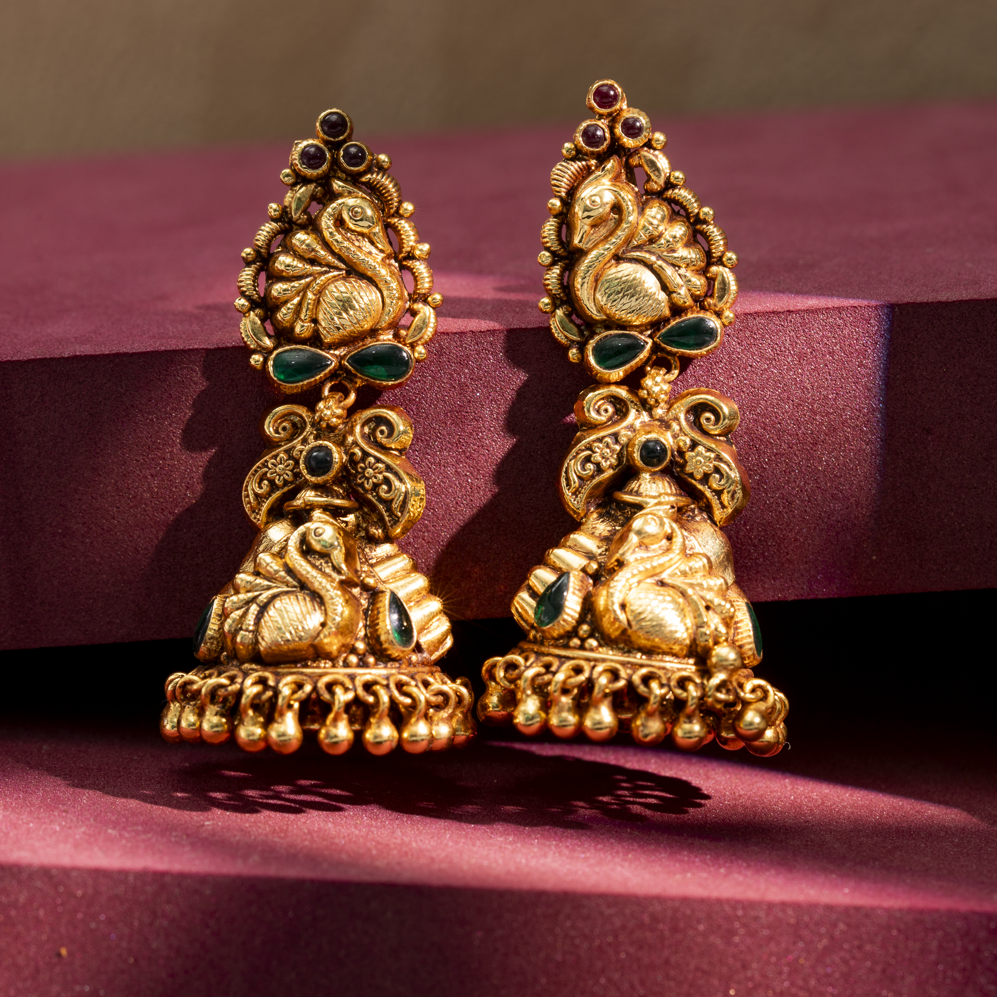 Gold plated peacock temple jhumka earrings