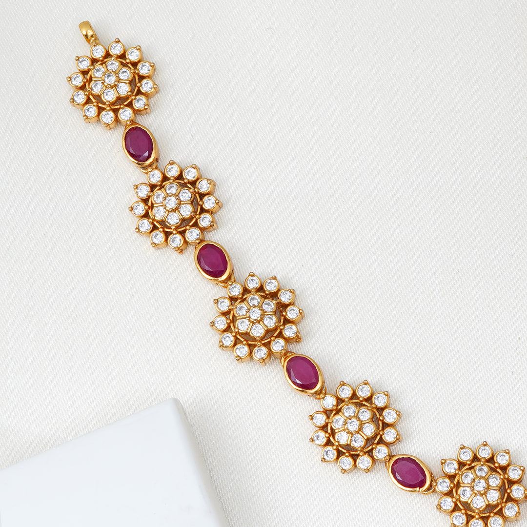 Handcrafted silver necklace with ruby and floral design