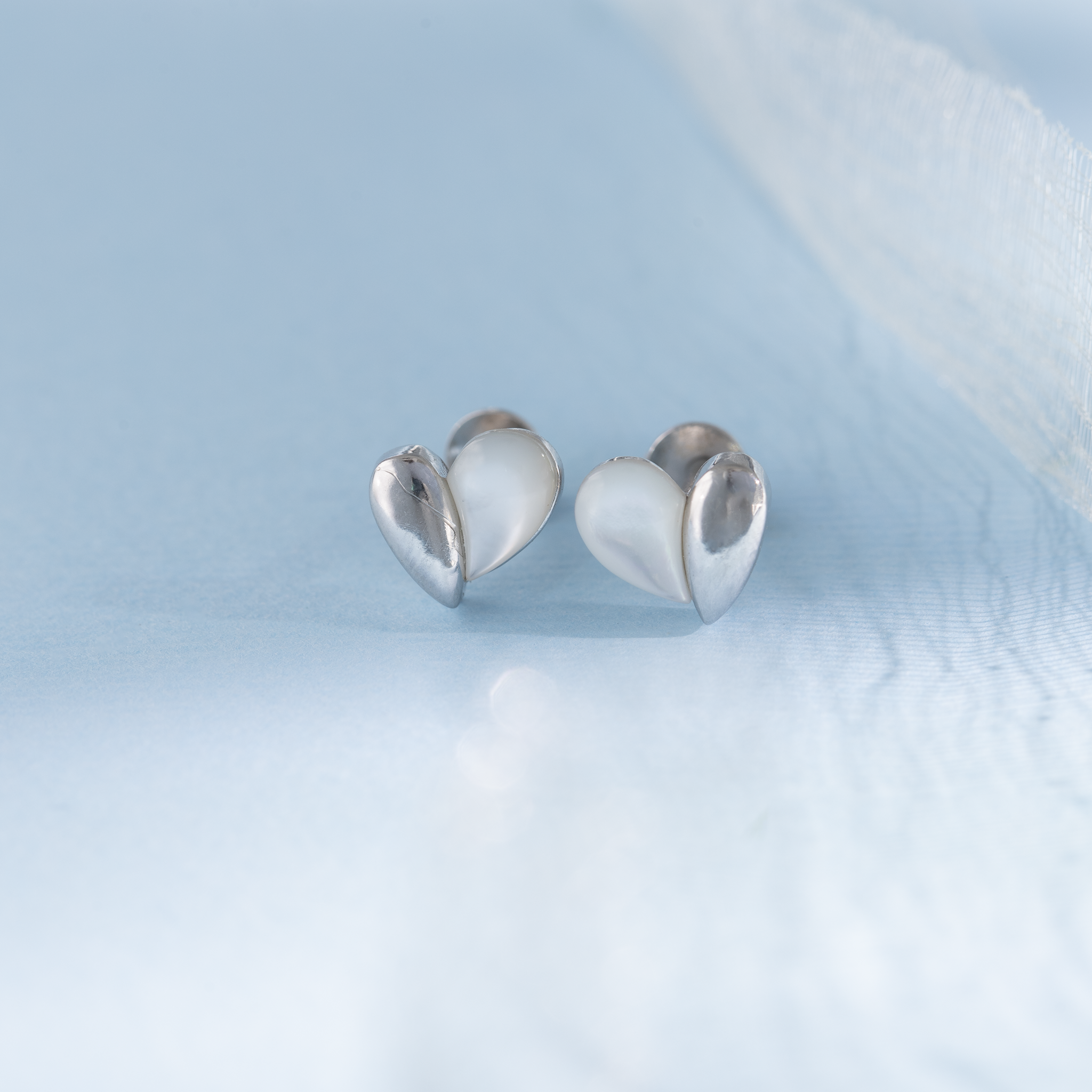 Heart shaped silver stud earrings