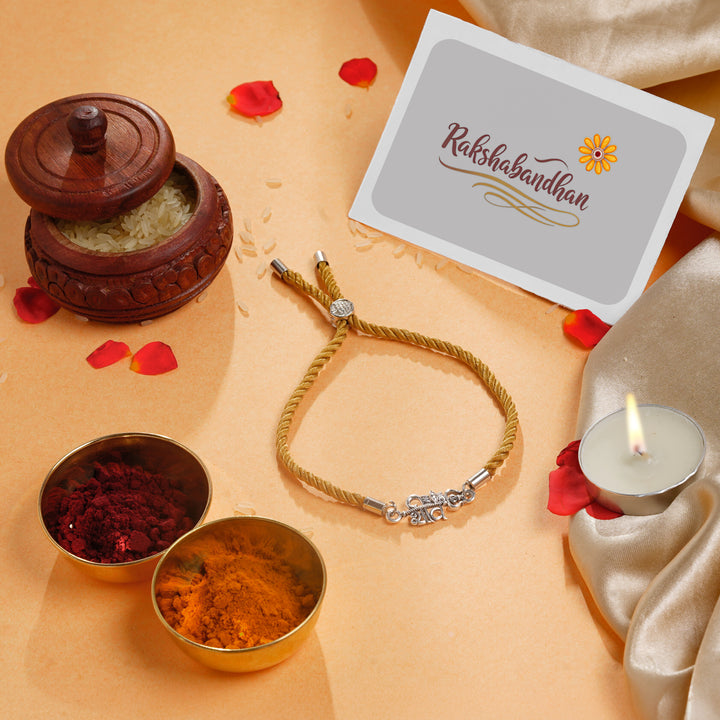 ISHNA 925 Silver Shiva Rakhi with Golden Thread