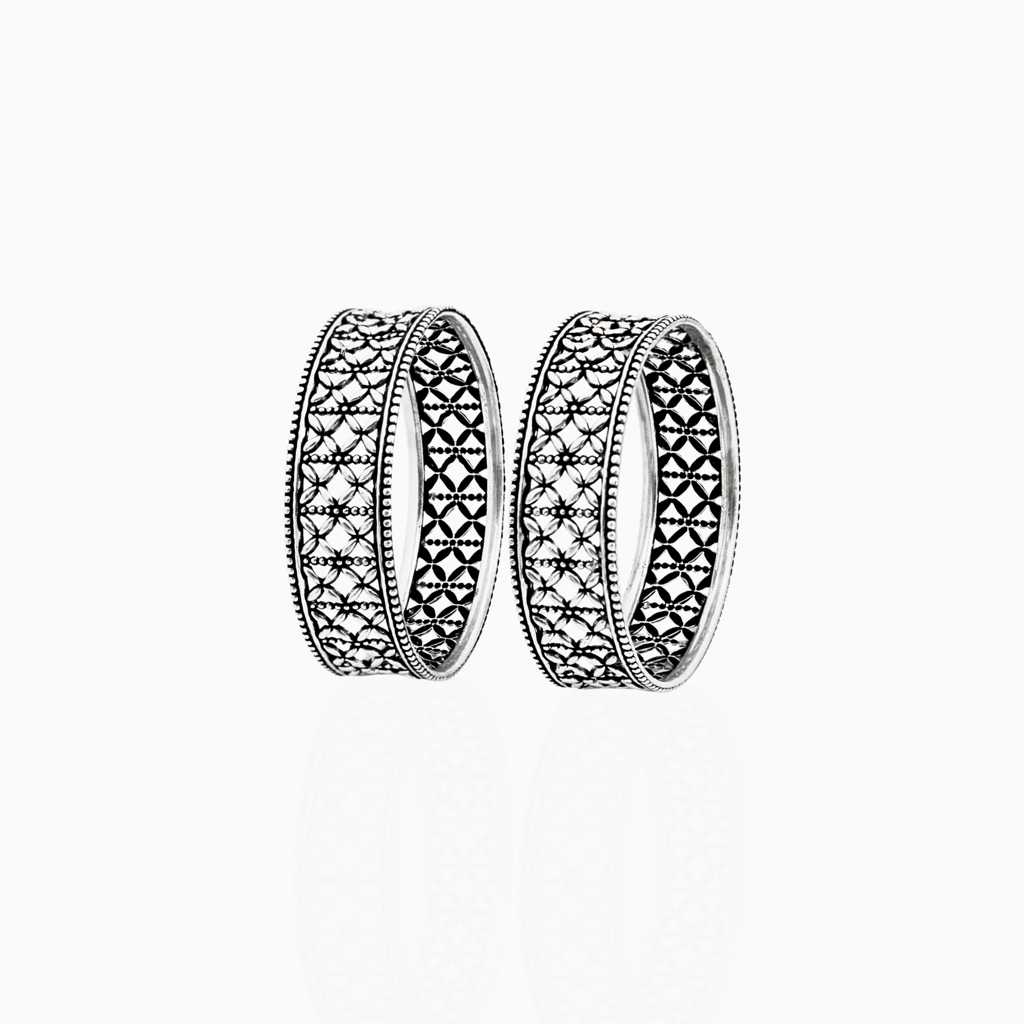 Intricate floral cut-out silver bangles