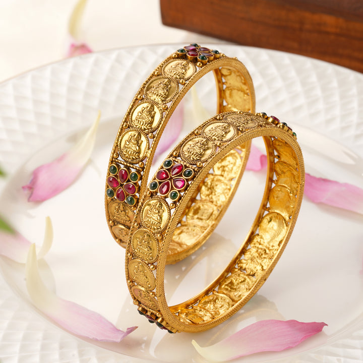 Lakshmi Nagas gold plated bangles with ruby emerald design