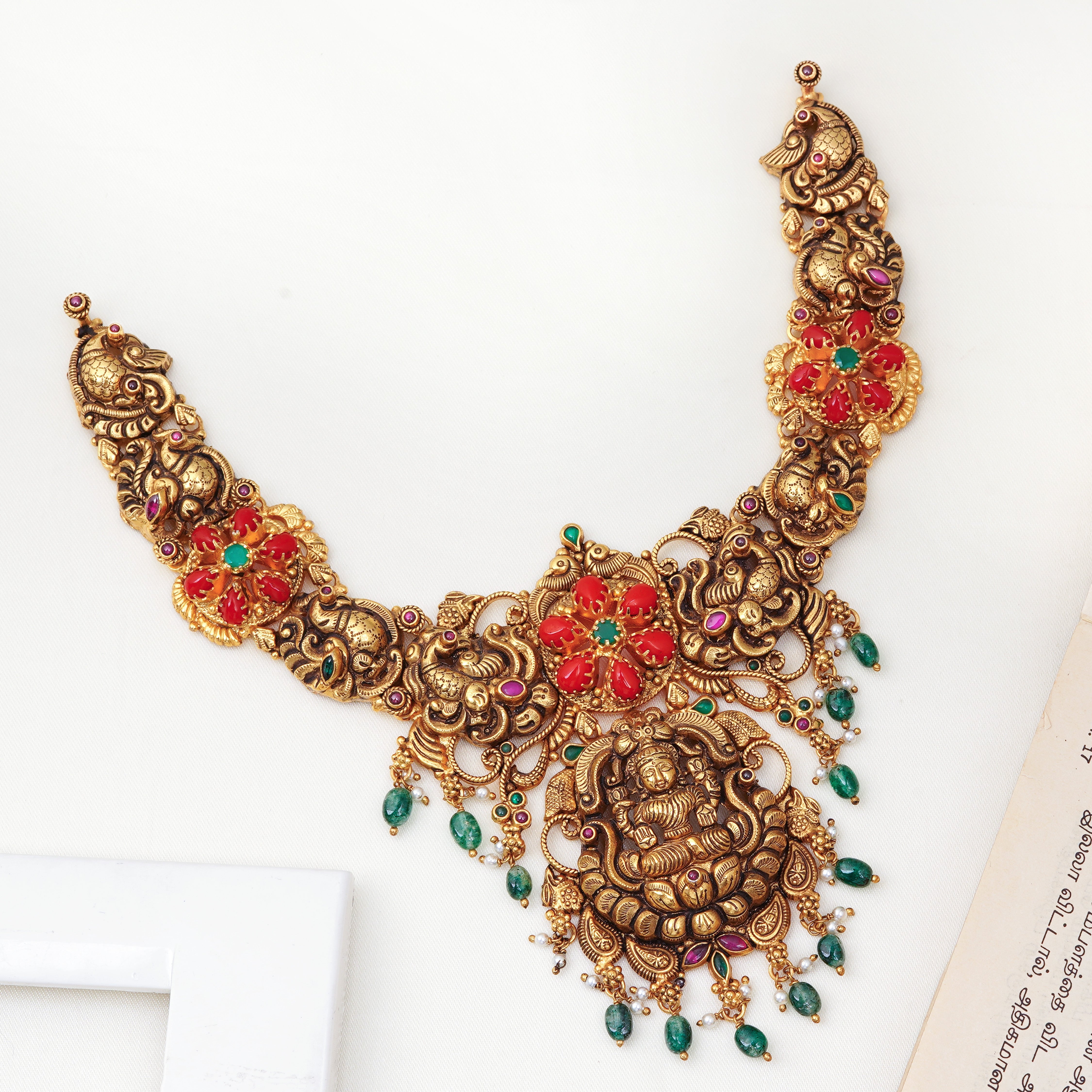 Lakshmi Nagas necklace with coral stones and emerald beads
