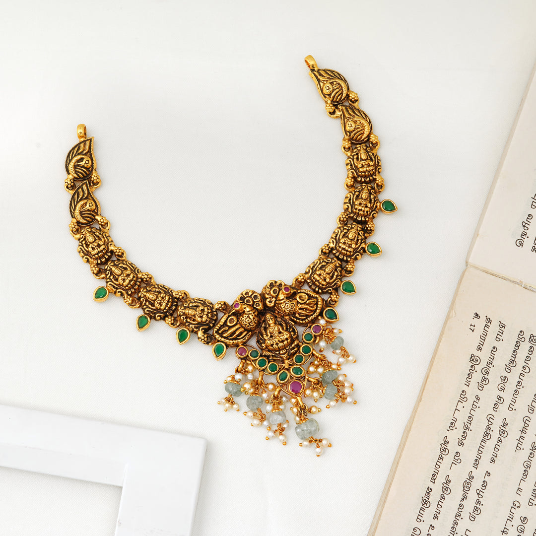 Lakshmi and peacock design short temple necklace with green stones