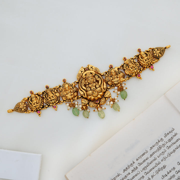 Lakshmi temple design choker in 24K gold-plated silver with green gemstone drops