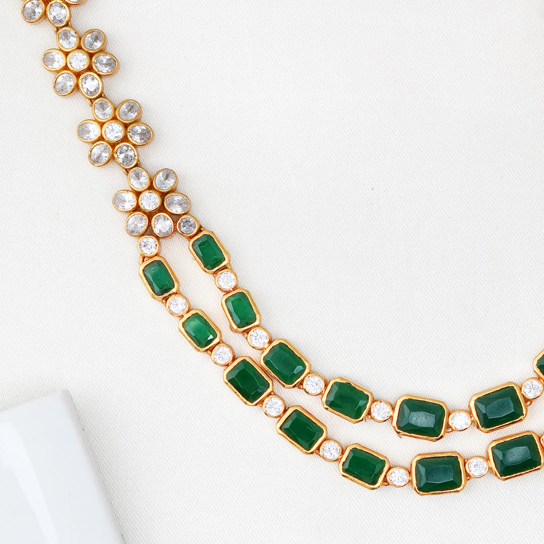 Layered silver jewellery necklace with floral clusters