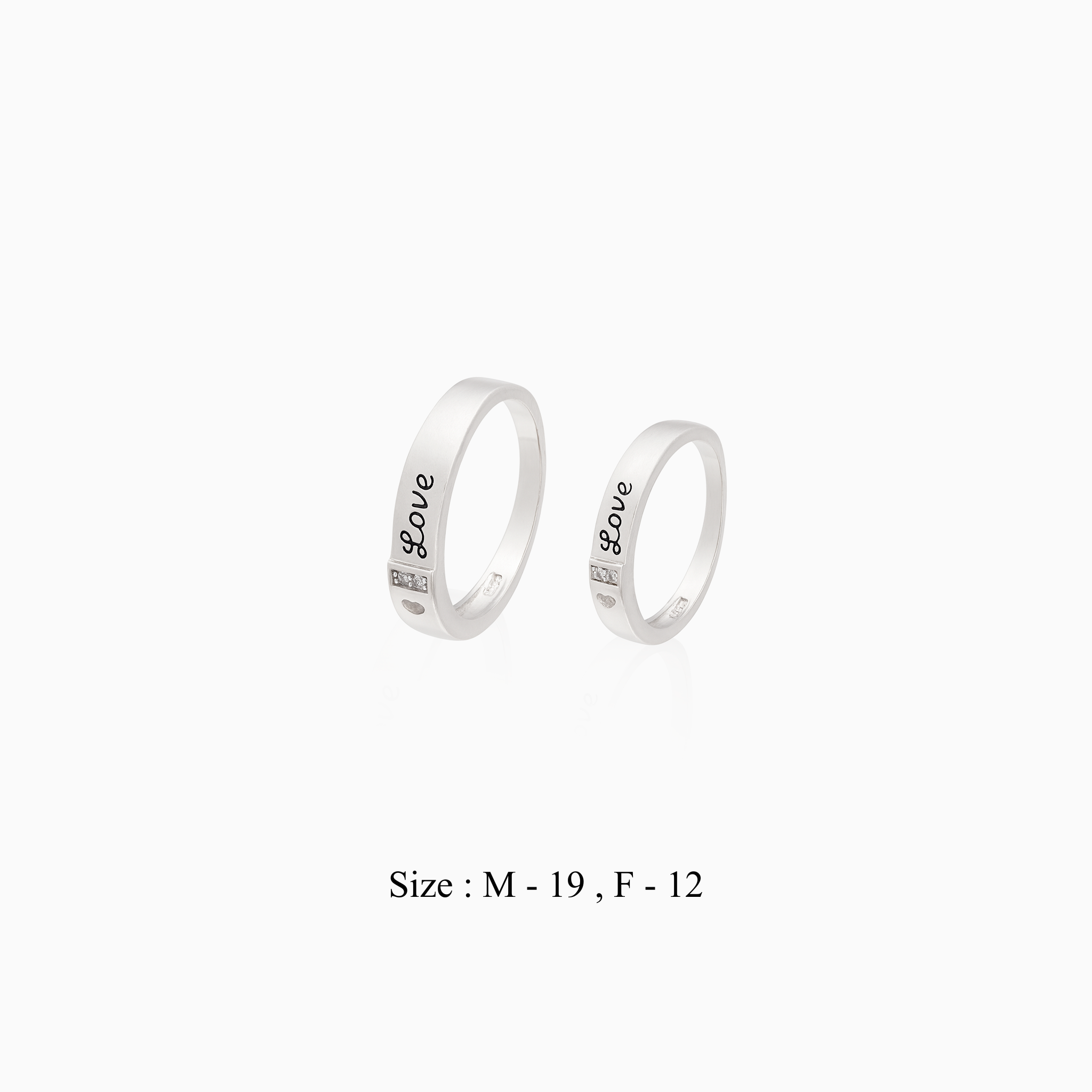 Minimal silver couple rings with heart detail