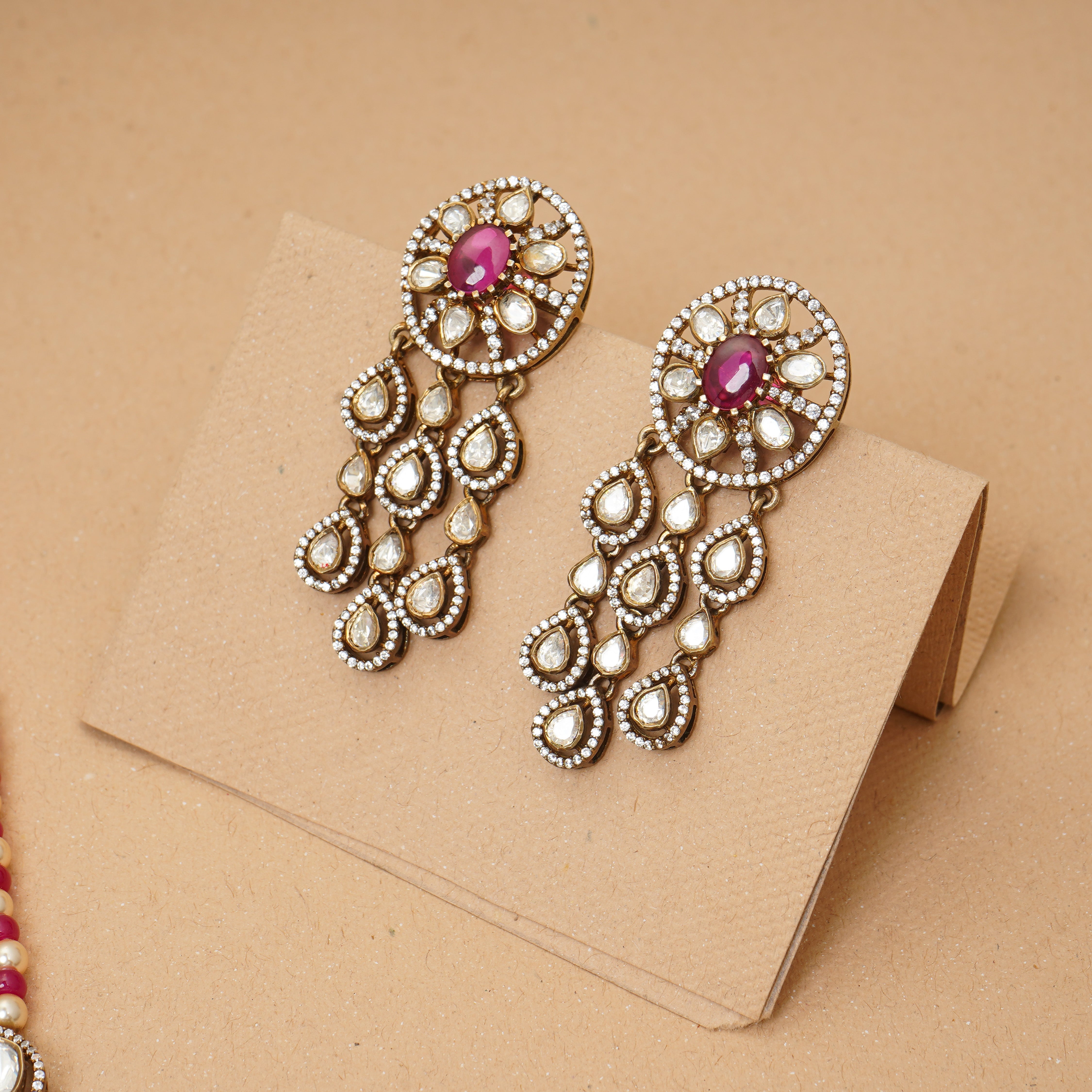 Moissanite and ruby stud in silver