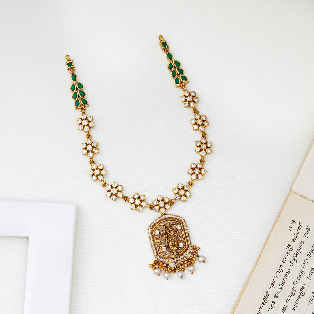 Nakshi work pendant necklace with green leaf stones and floral clusters