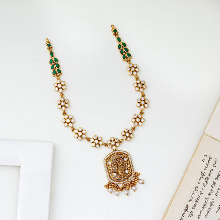 Nakshi work pendant necklace with green leaf stones and floral clusters