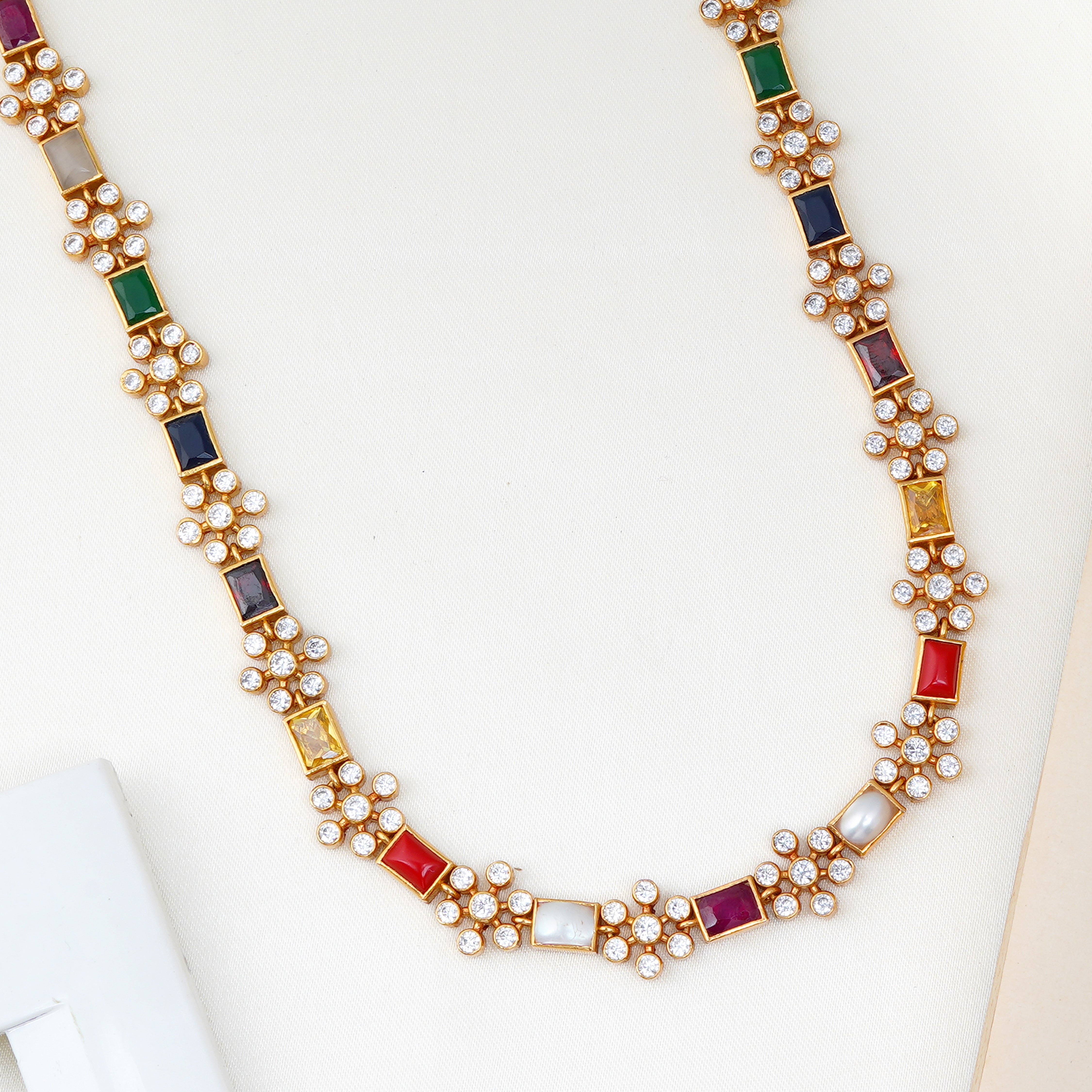 Navarathnam stone necklace with floral pearl accents