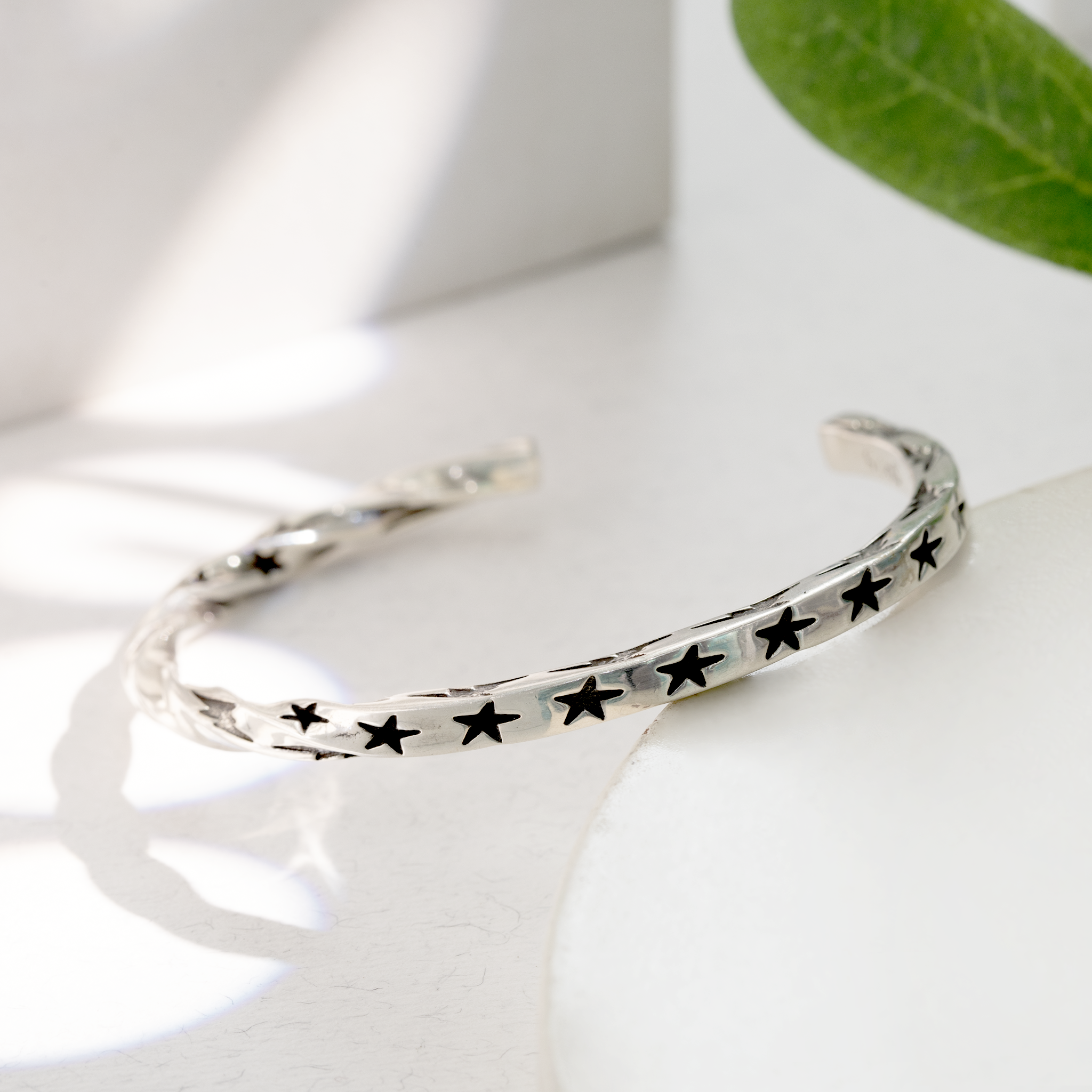 Open star cut silver bracelet