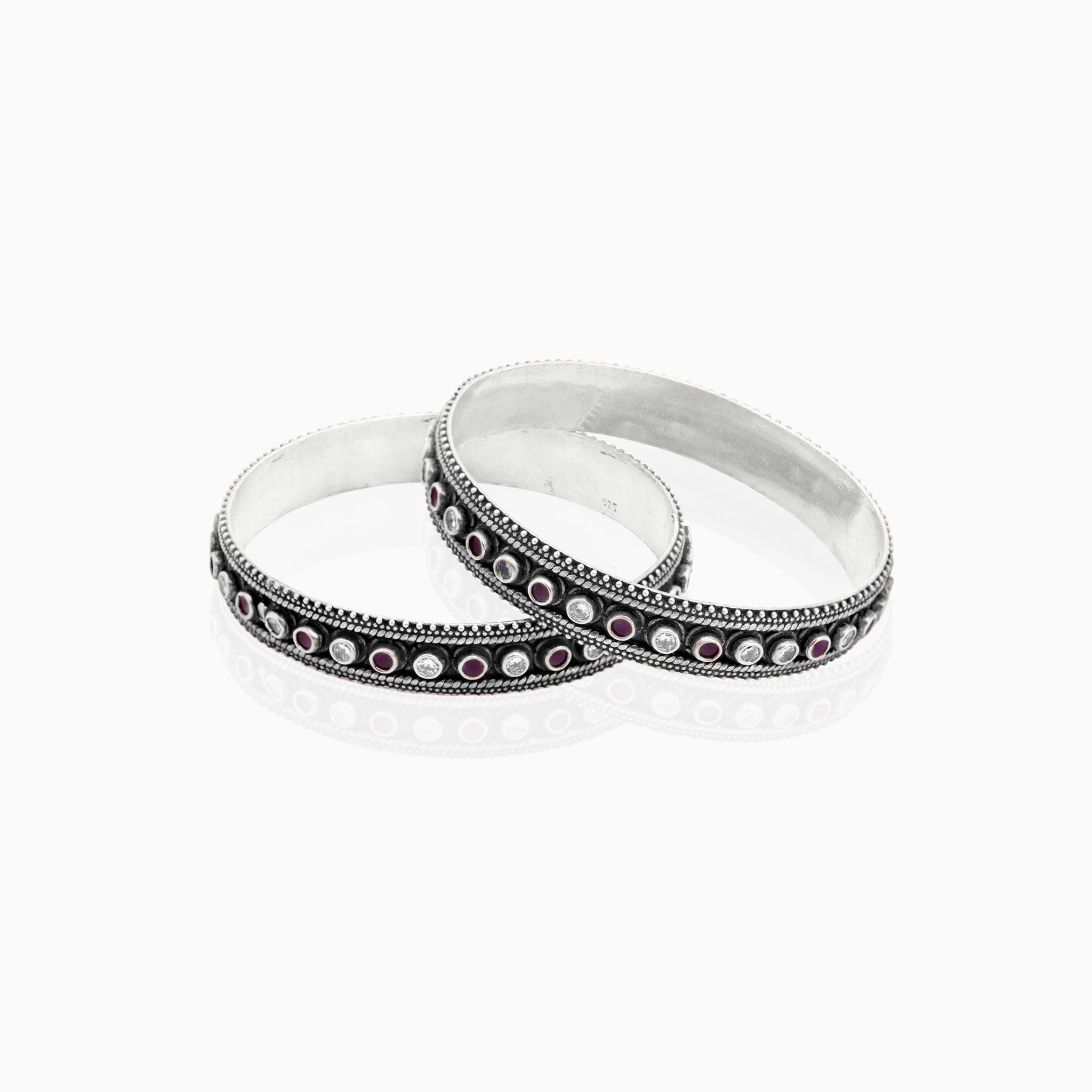 Oxidized silver bangle with red stones