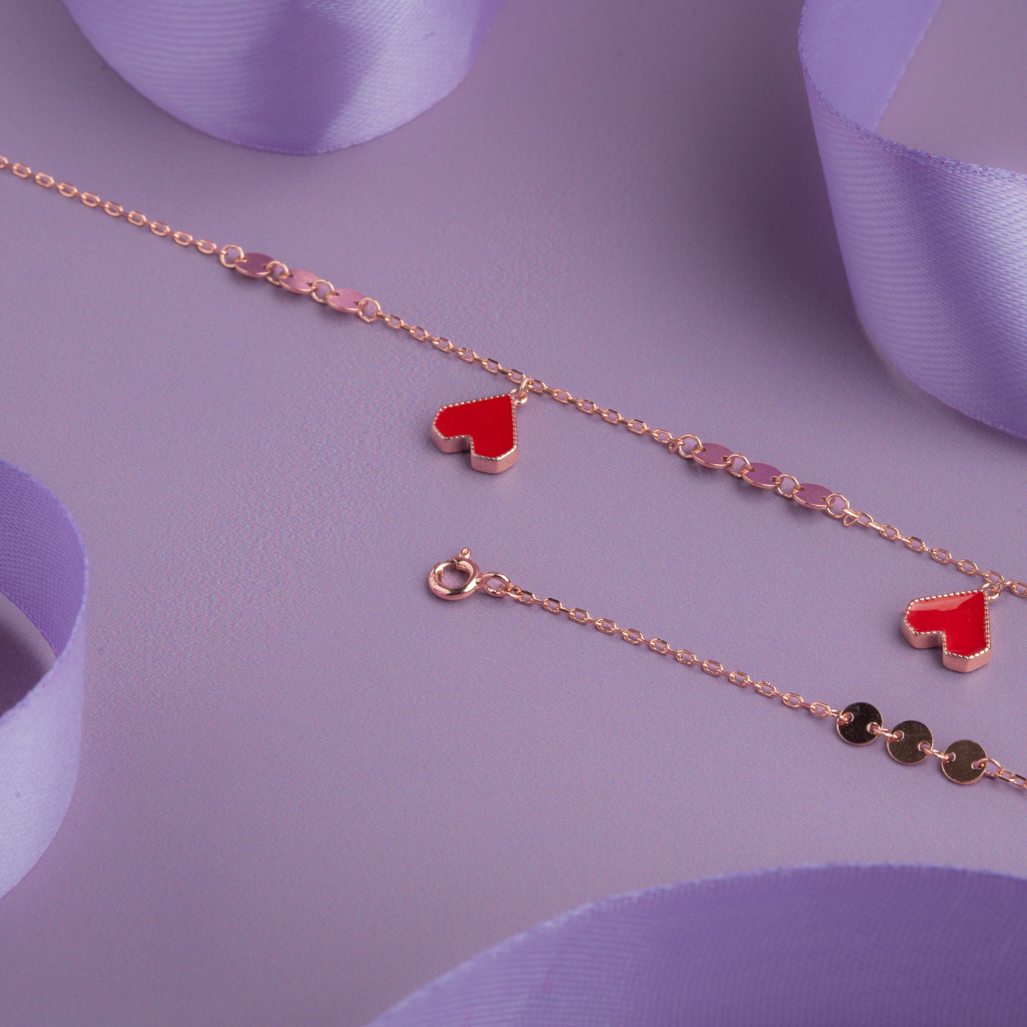Rose gold anklet with red enamel heart charms 
