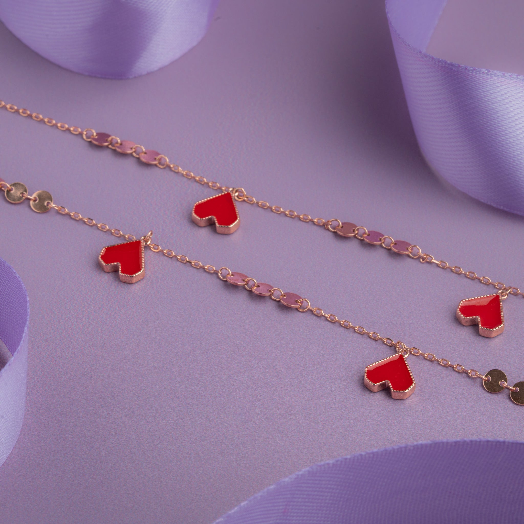Rose gold anklet with red enamel heart charms and coin links