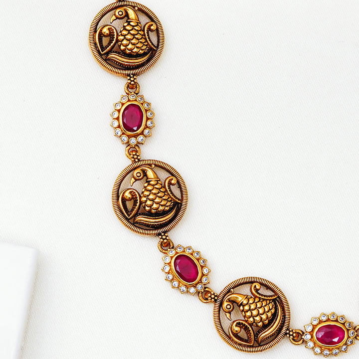 Ruby floral necklace with peacock medallion accents