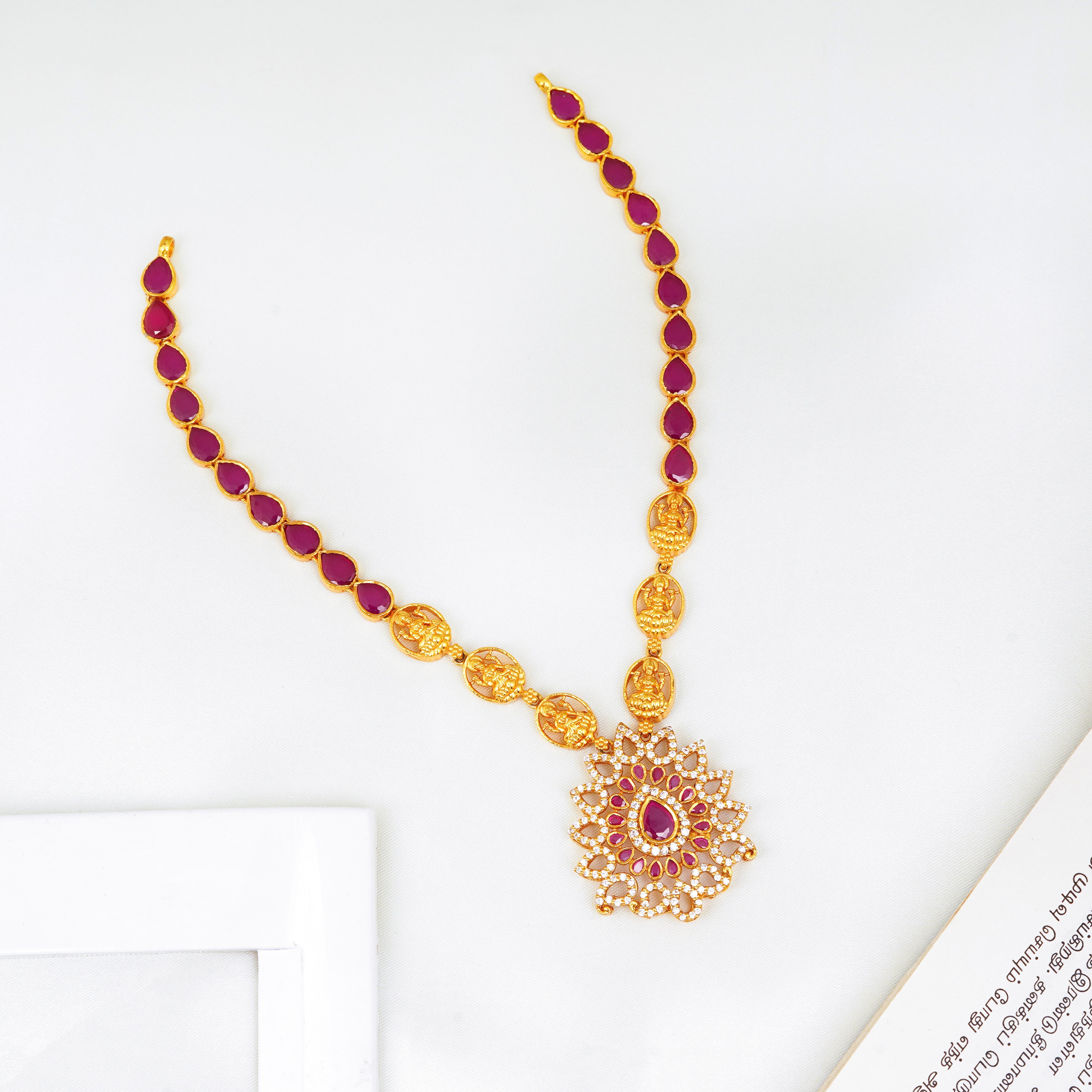 Ruby stone Lakshmi necklace with gold plating and Swarovski crystals