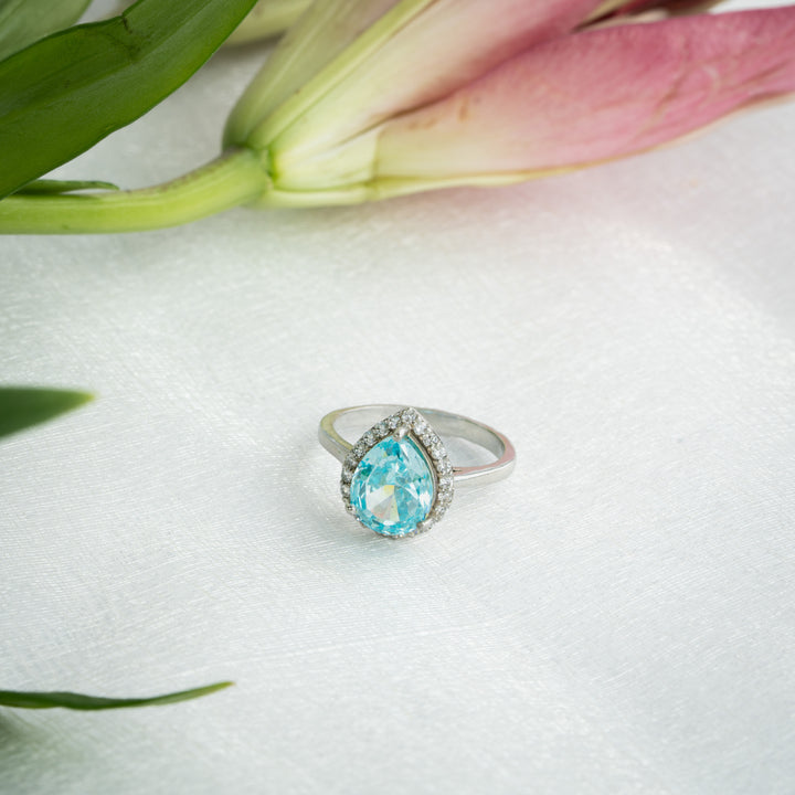 Pear Cut Blue Topaz Halo Ring