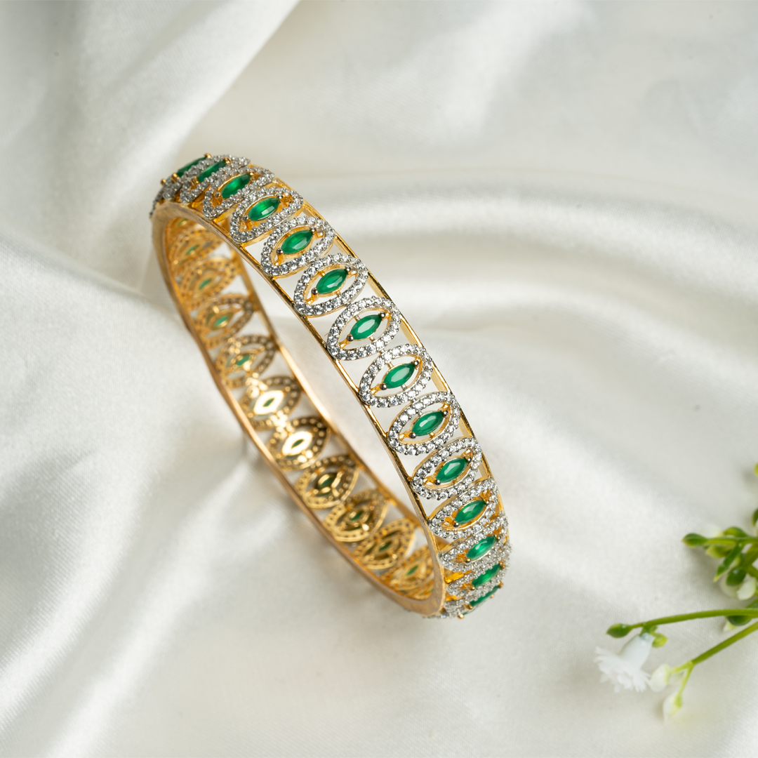 SWAROVSKI BANGLE WITH EMERALD STONES