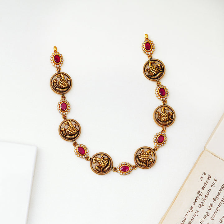 Short antique necklace with peacock design and ruby floral stones