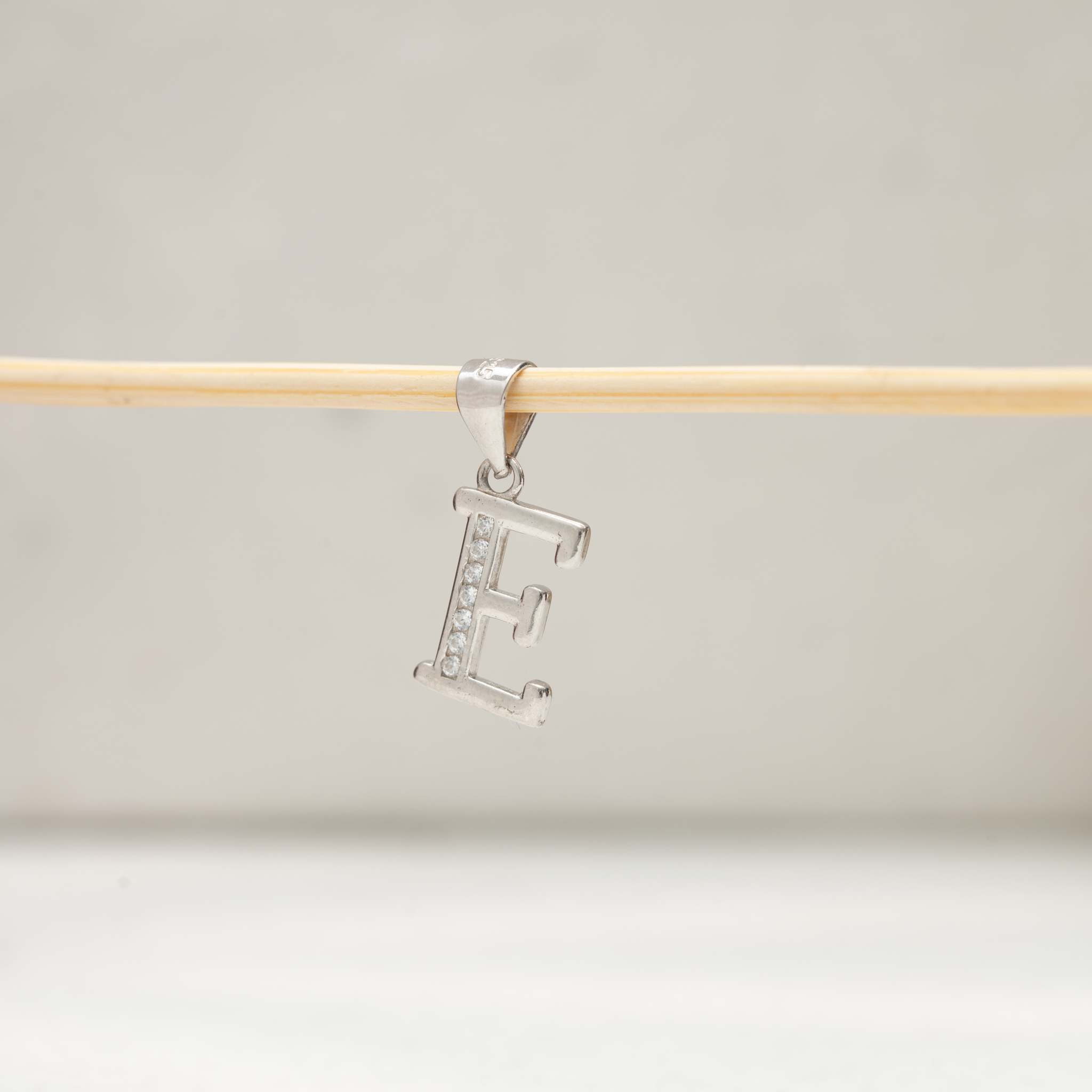 Silver E letter pendant